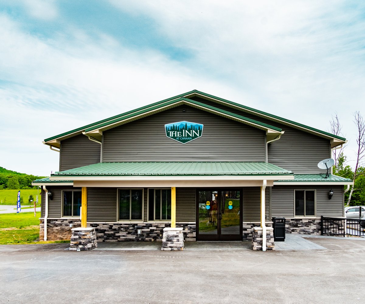 The forest green façade of The Inn at Canaan on ten acres of rolling Canaan Valley land
